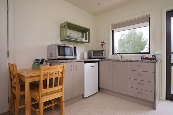kitchenette with microwave and oven